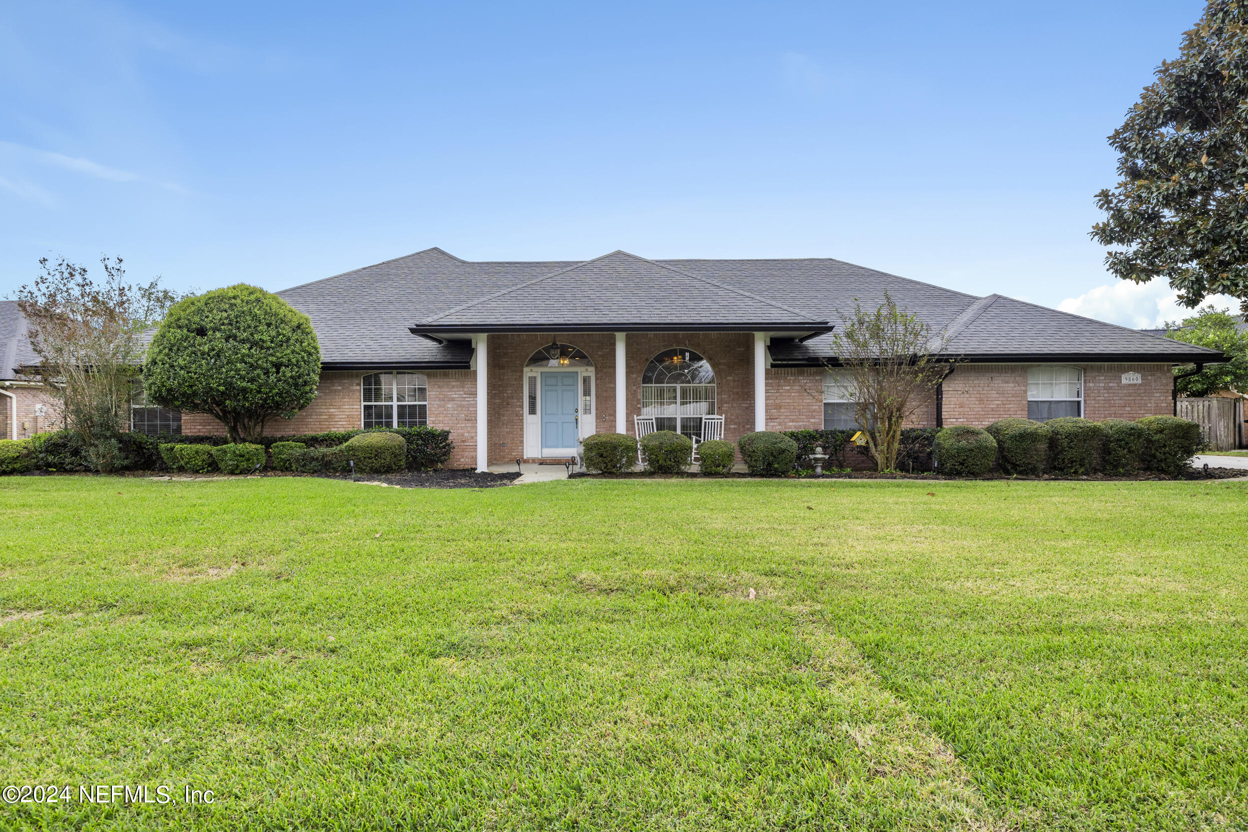 a front view of a house with garden