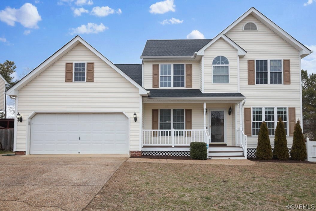 a front view of a house with a garage