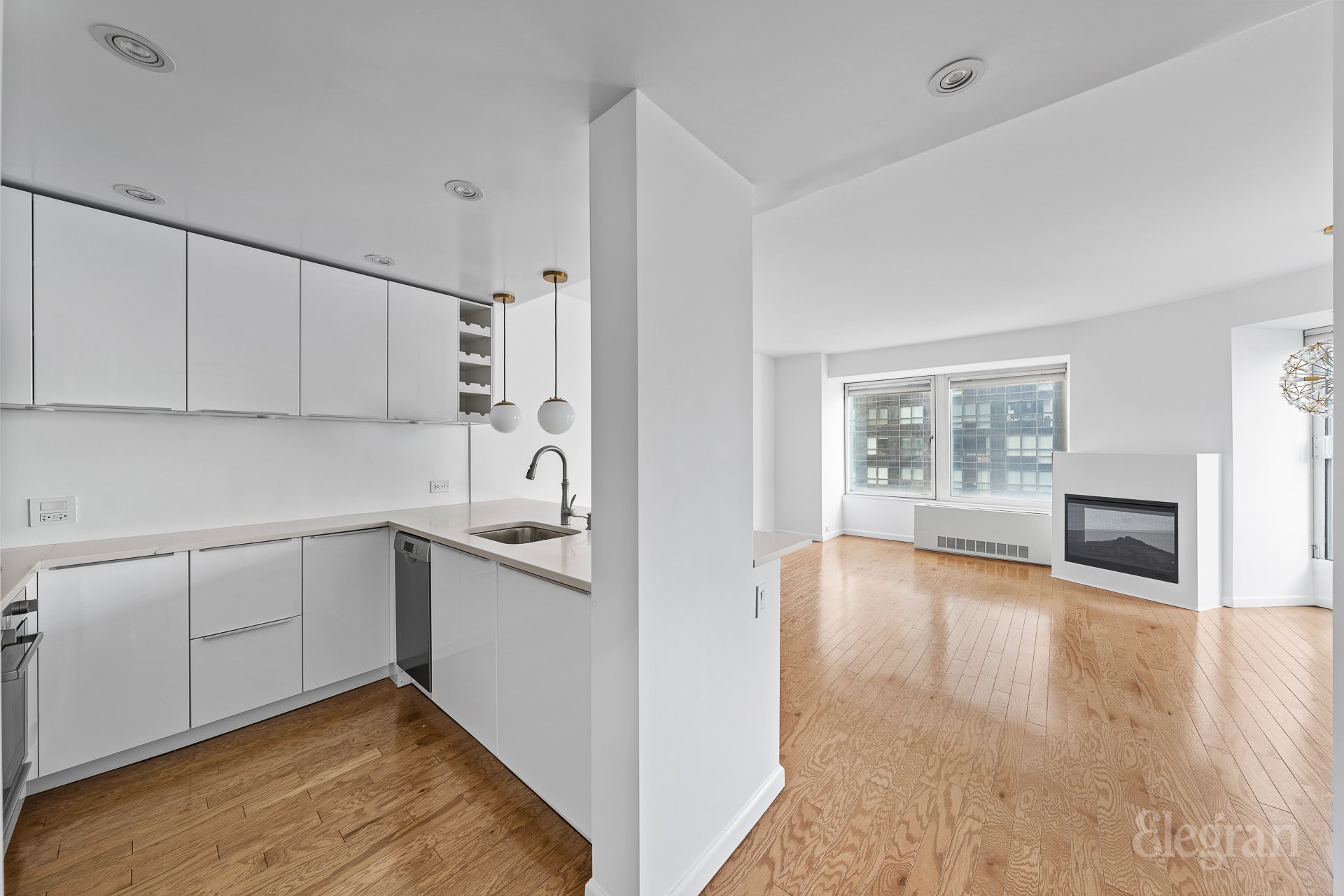 a kitchen with a sink and cabinets