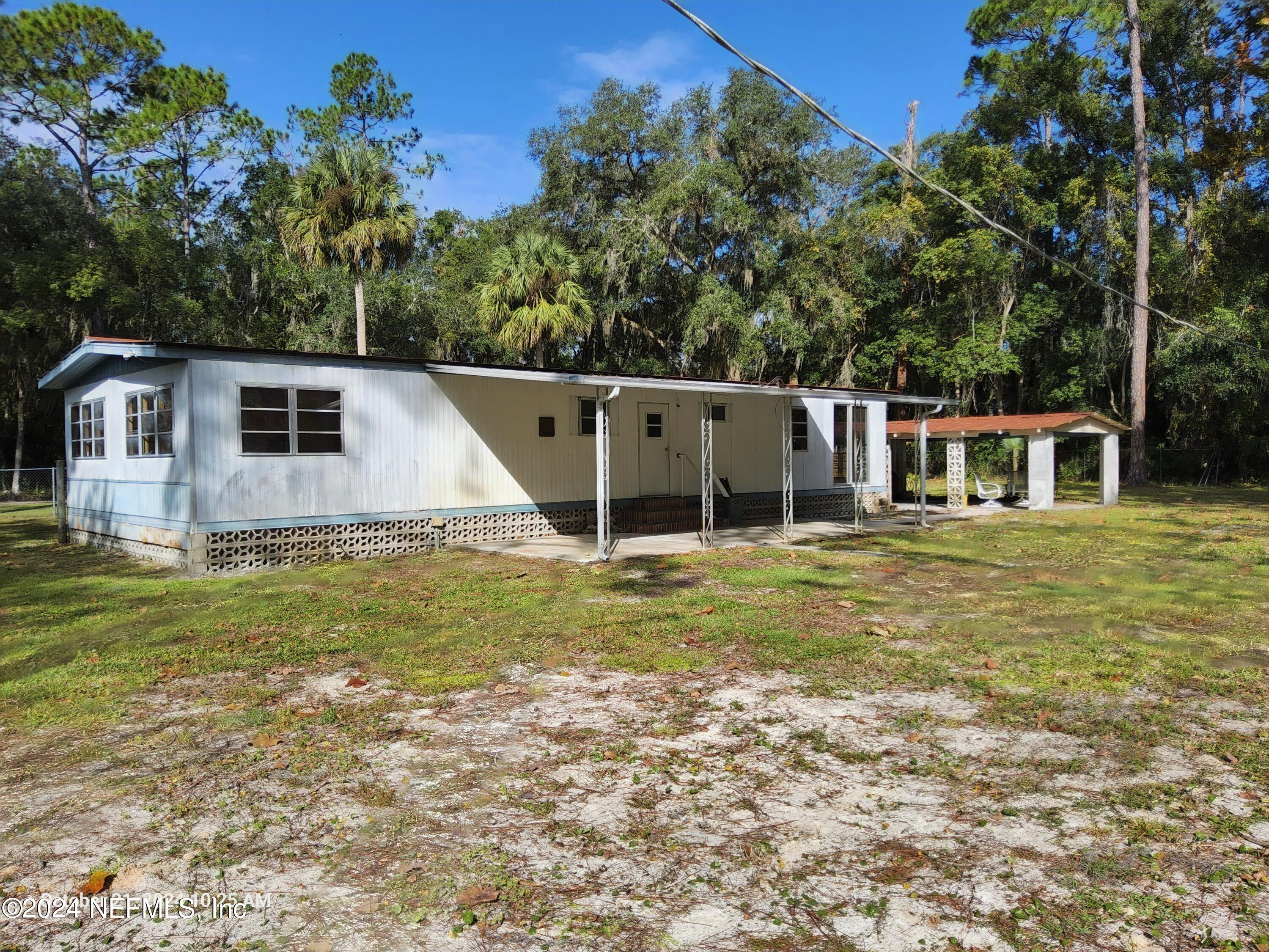 a front view of house with garden