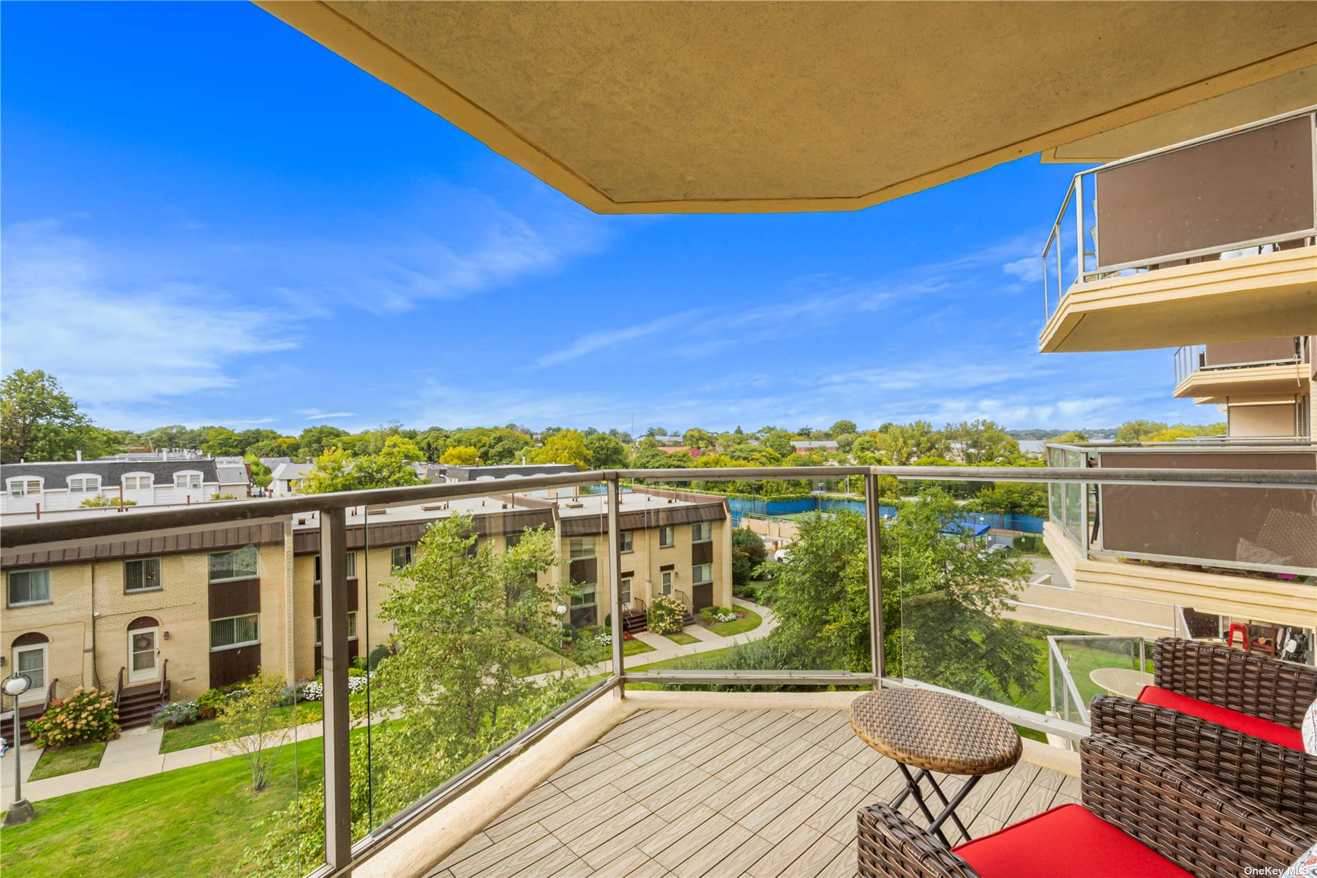 a view of a balcony with lake view and a ocean view