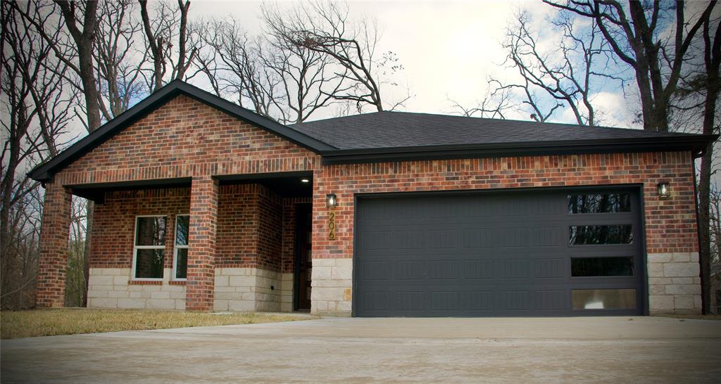 a view of a house and a yard