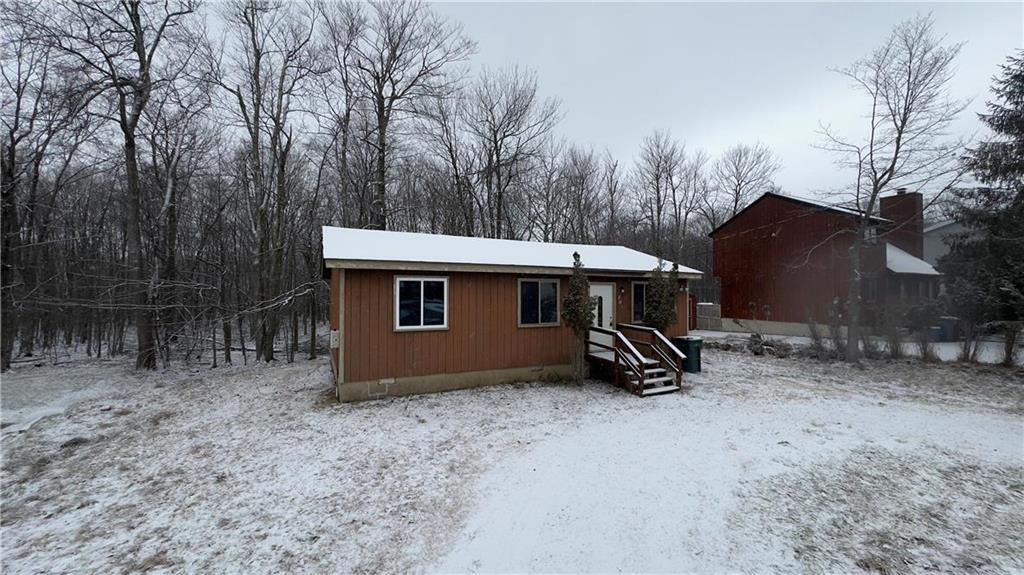 a view of a barn in the middle of a yard