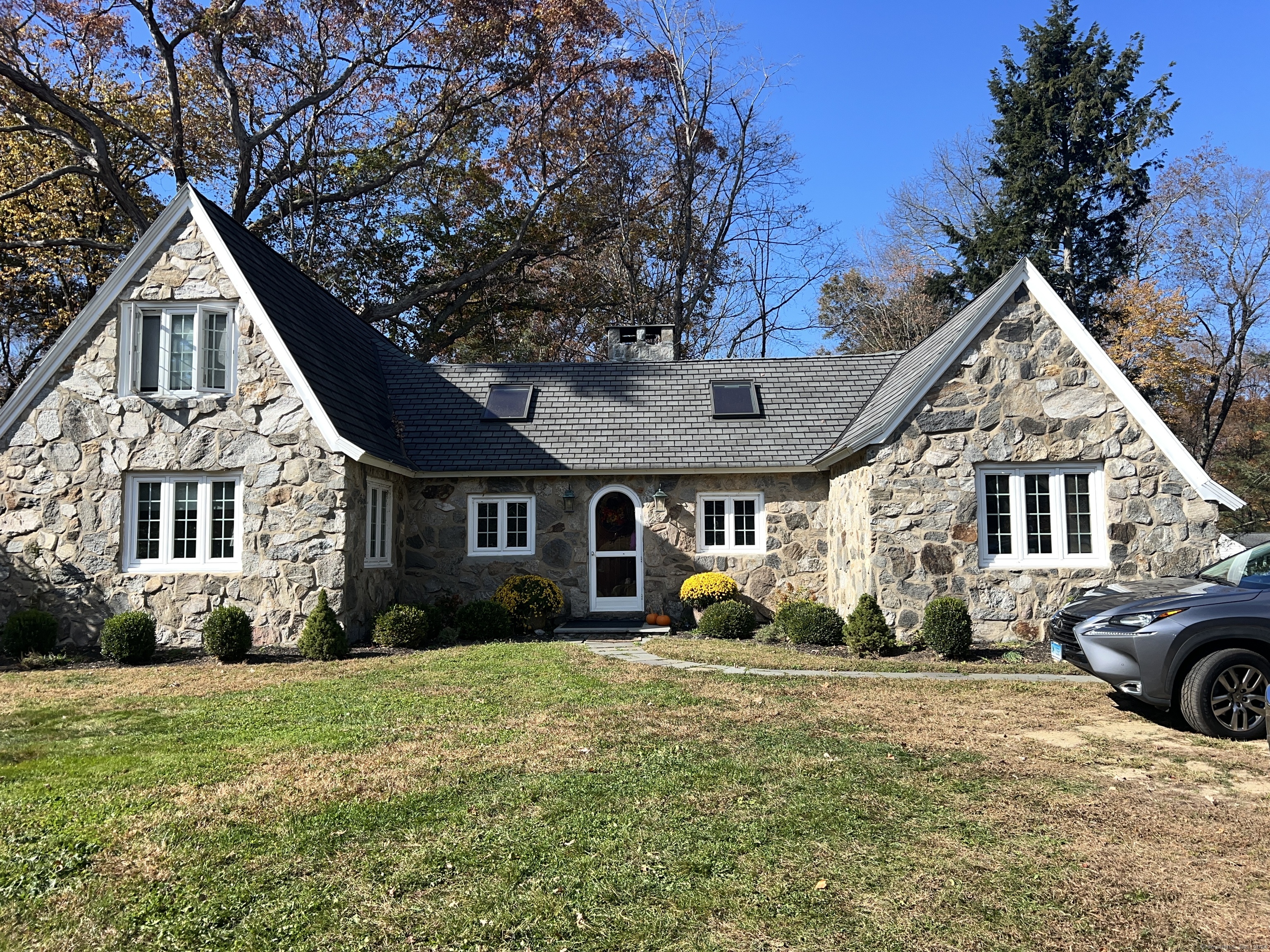 a front view of a house with garden