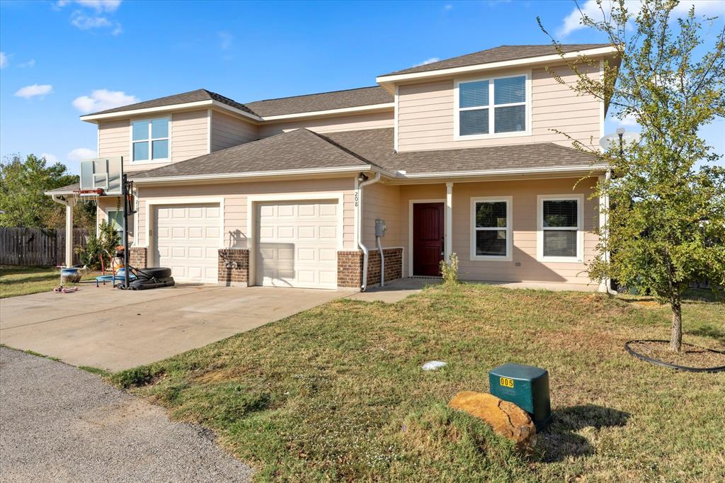 a front view of a house with a yard