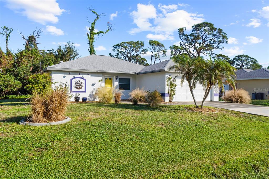 a front view of a house with garden