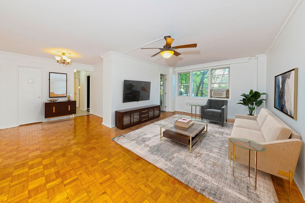 a living room with furniture and a flat screen tv