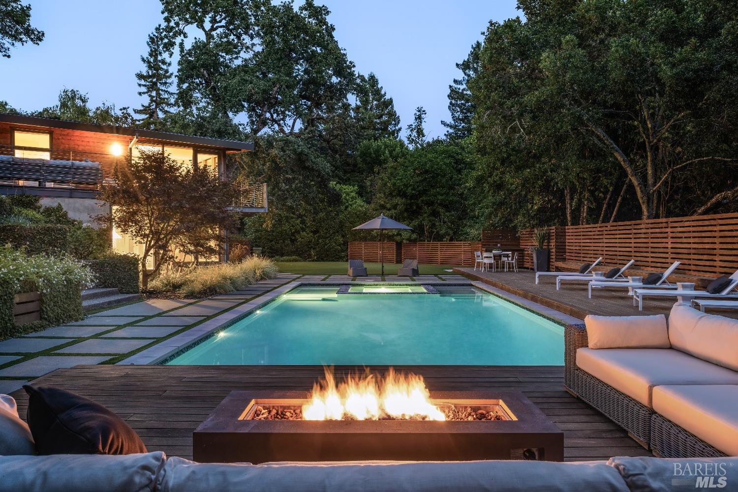 swimming pool view with a seating space