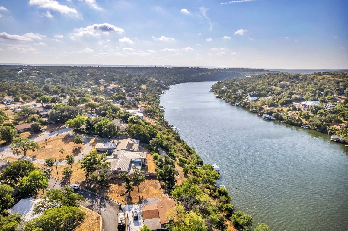 an aerial view of a house with a lake view