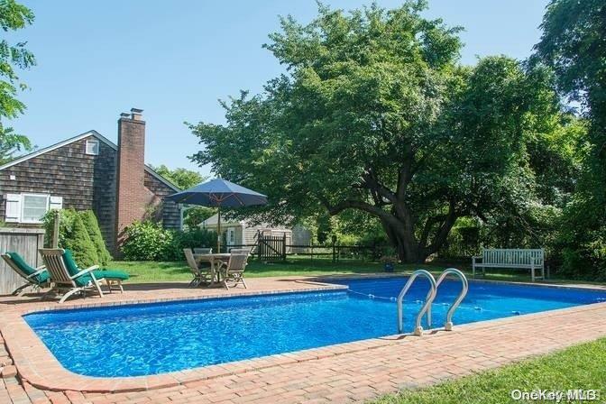 a view of a swimming pool with a patio