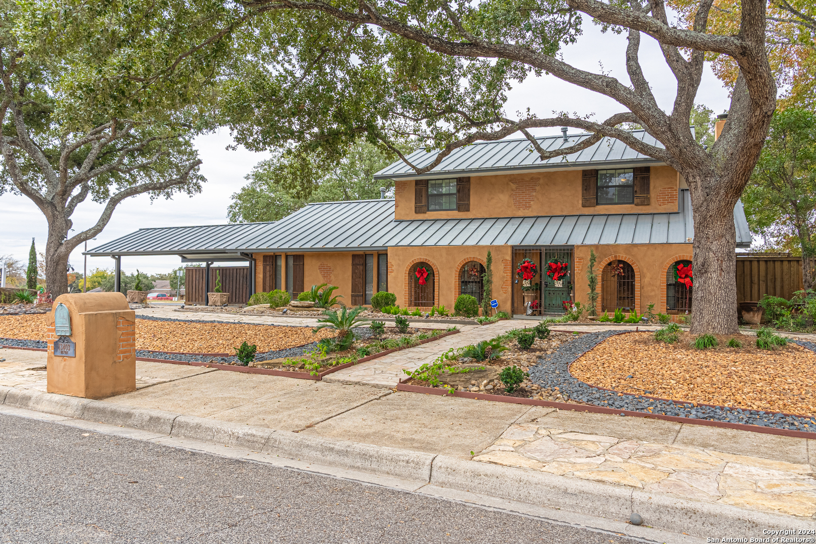 a front view of a house with garden