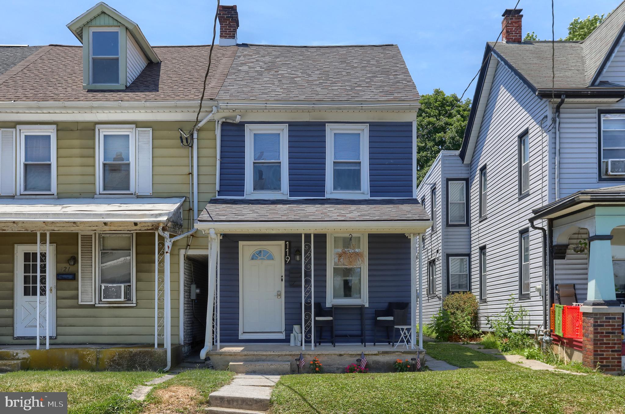 front view of a house with a yard