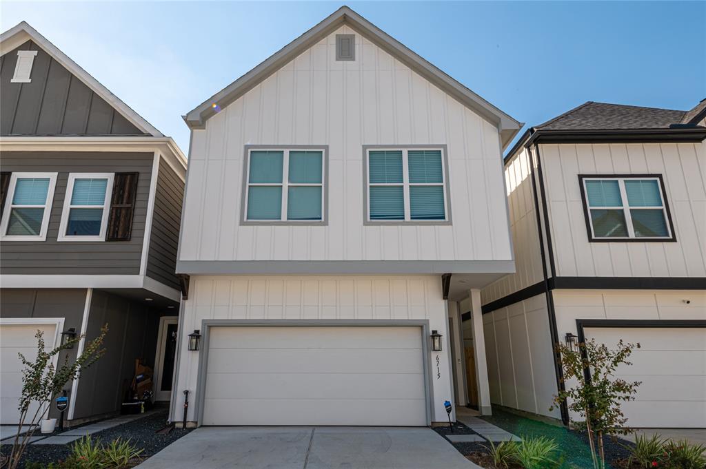 a front view of a house with a garage