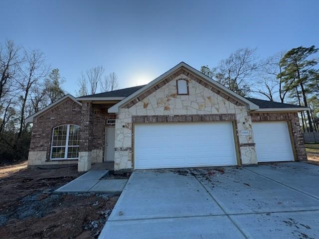 a front view of a house with a garage