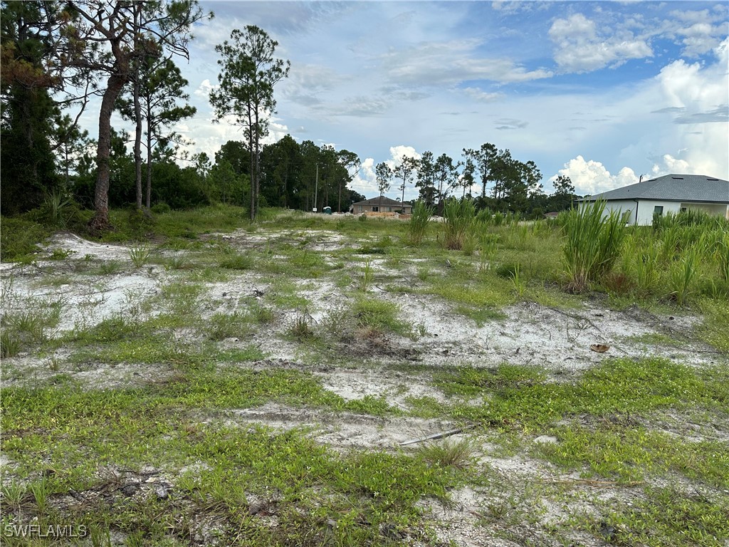 a view of a golf course with a lake