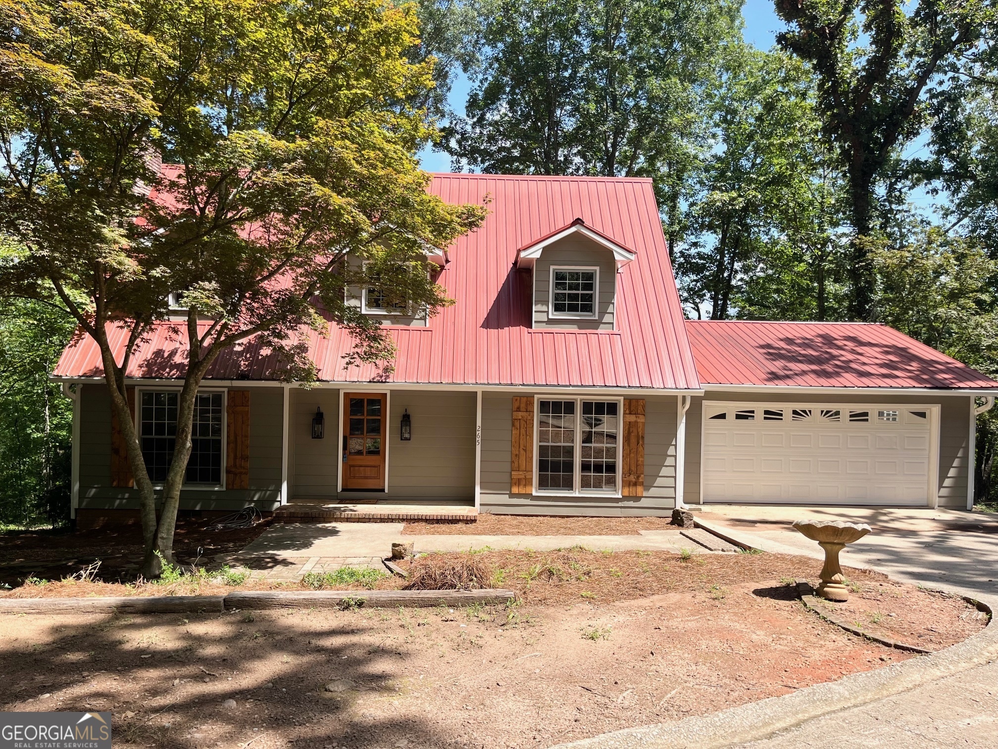 a house with trees in front of it