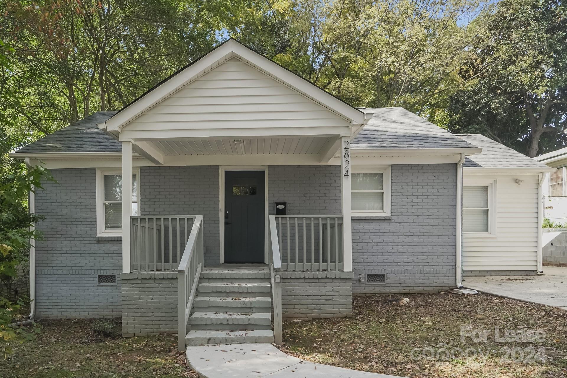 a front view of a house with a porch