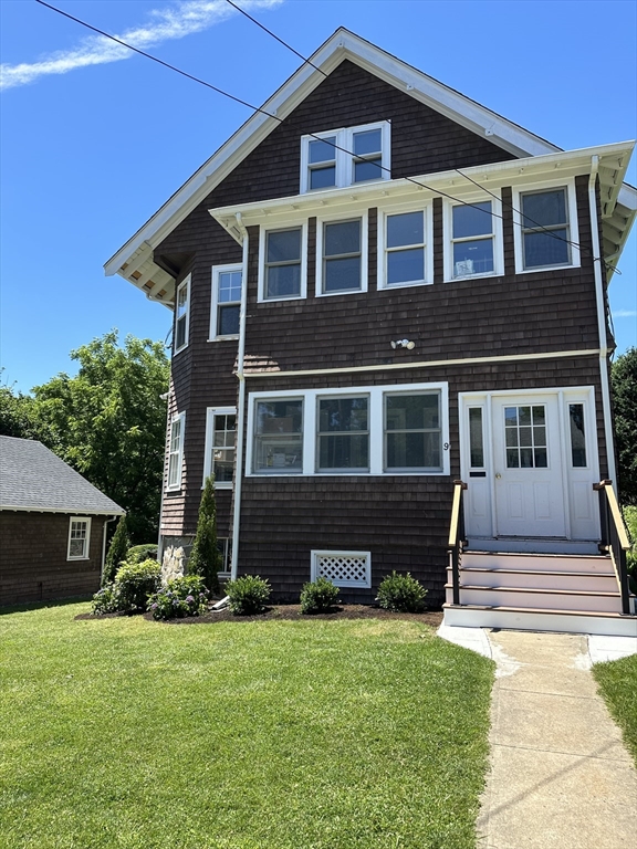 a front view of a house with a yard