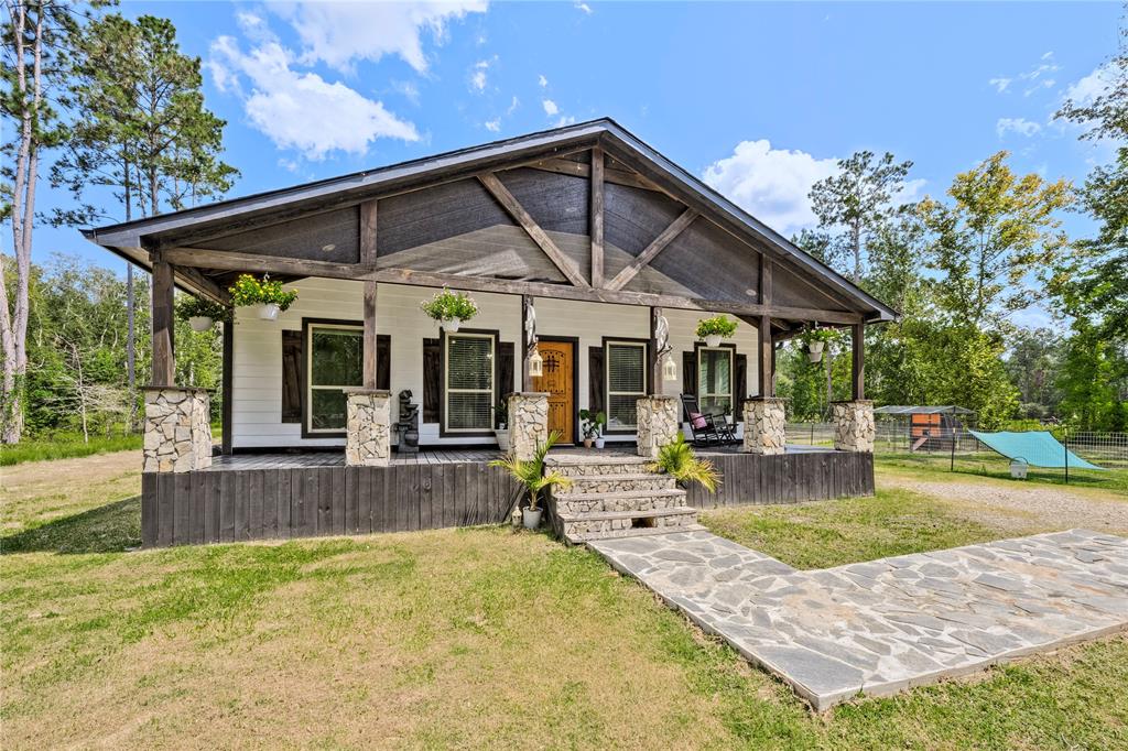 a view of a house with swimming pool and porch