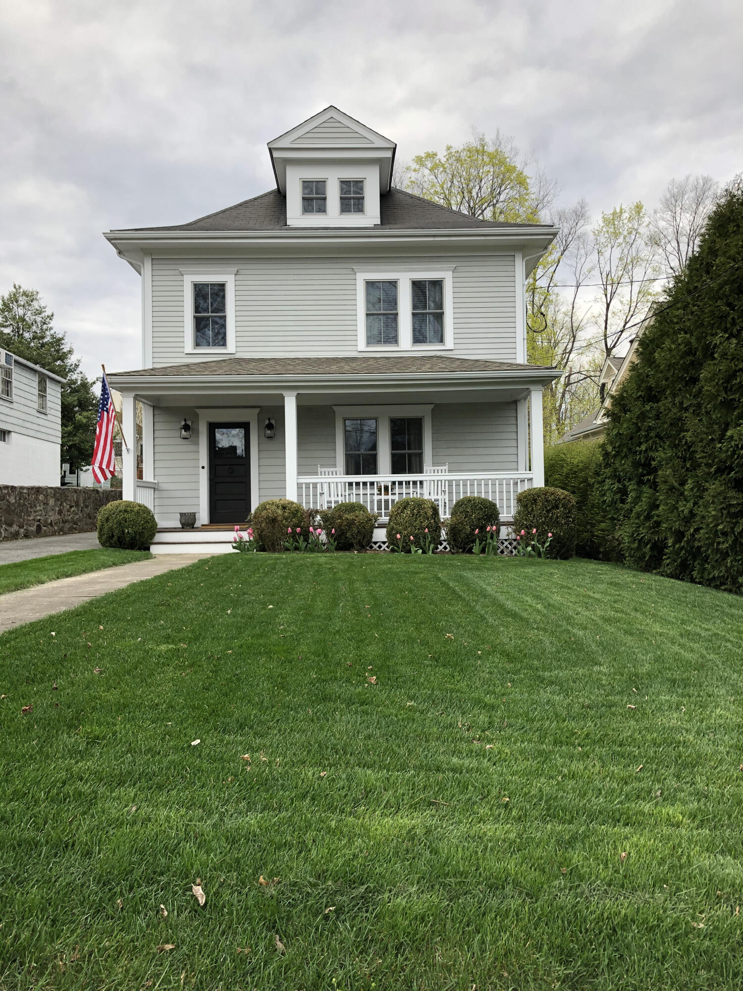 a front view of house with yard and green space