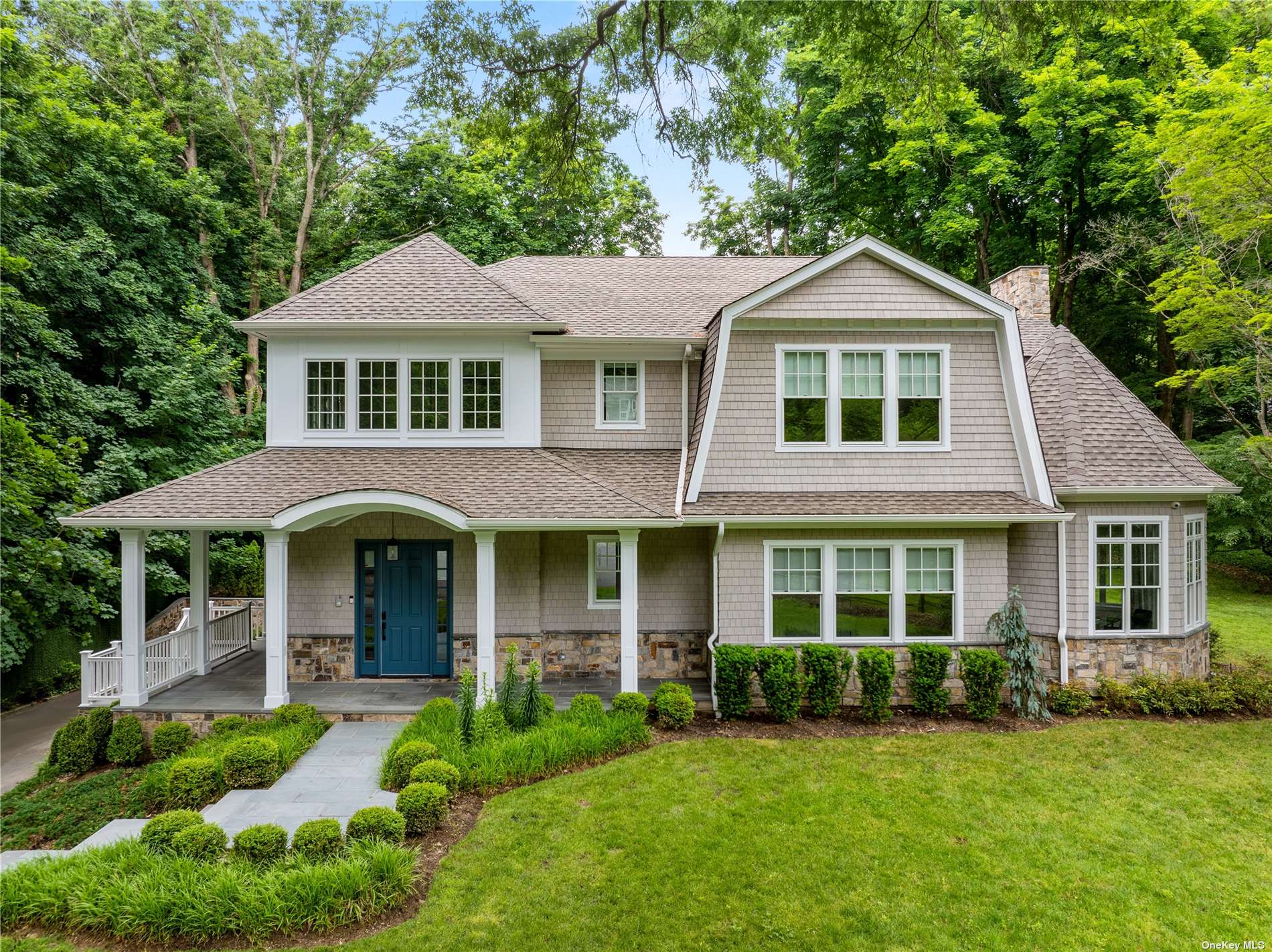 a front view of a house with a yard