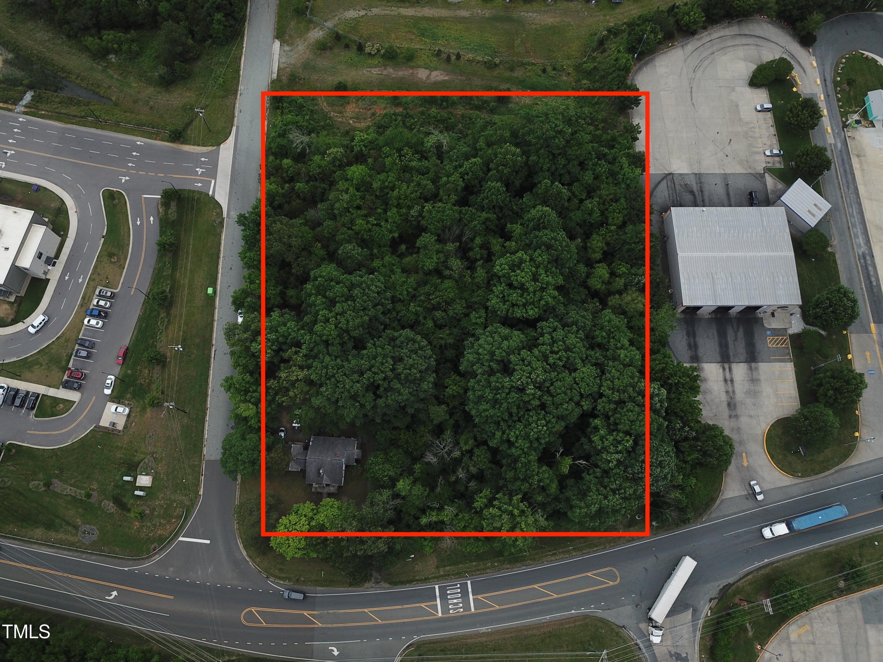 an aerial view of houses with yard