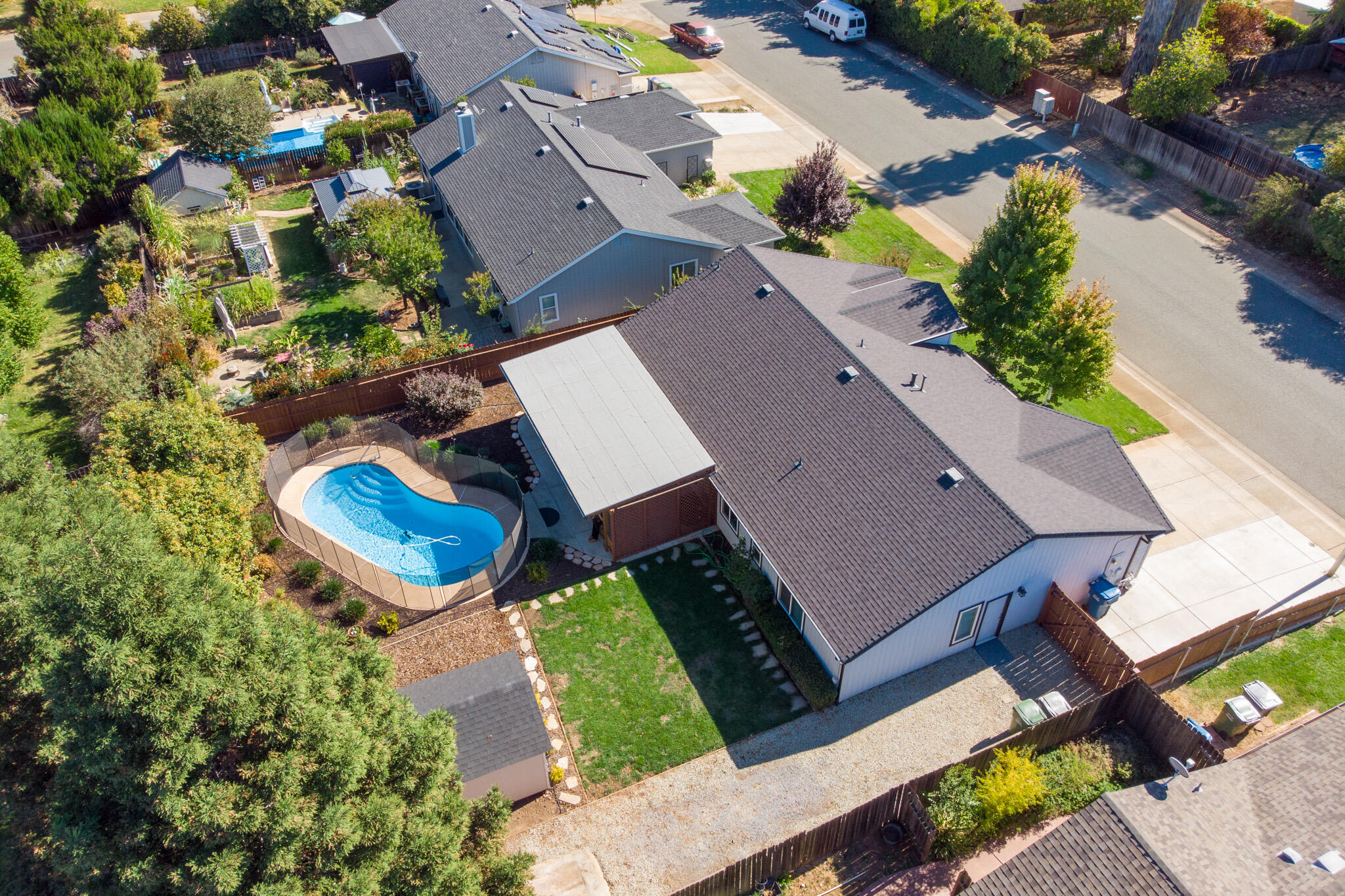 an aerial view of residential house with outdoor space and parking