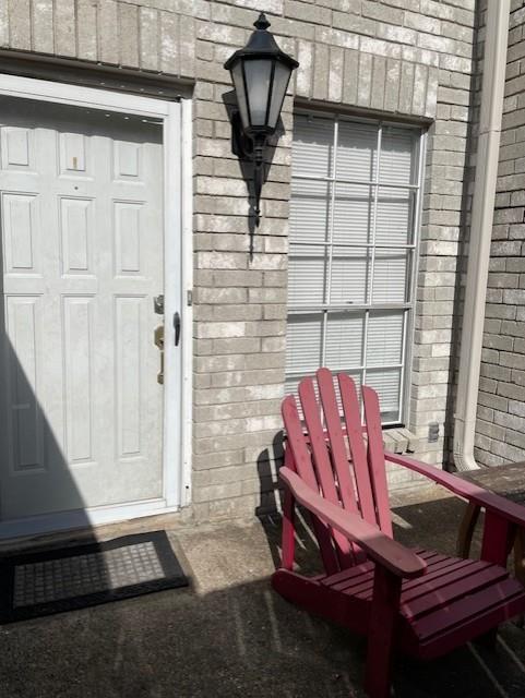 a view of a balcony with chairs