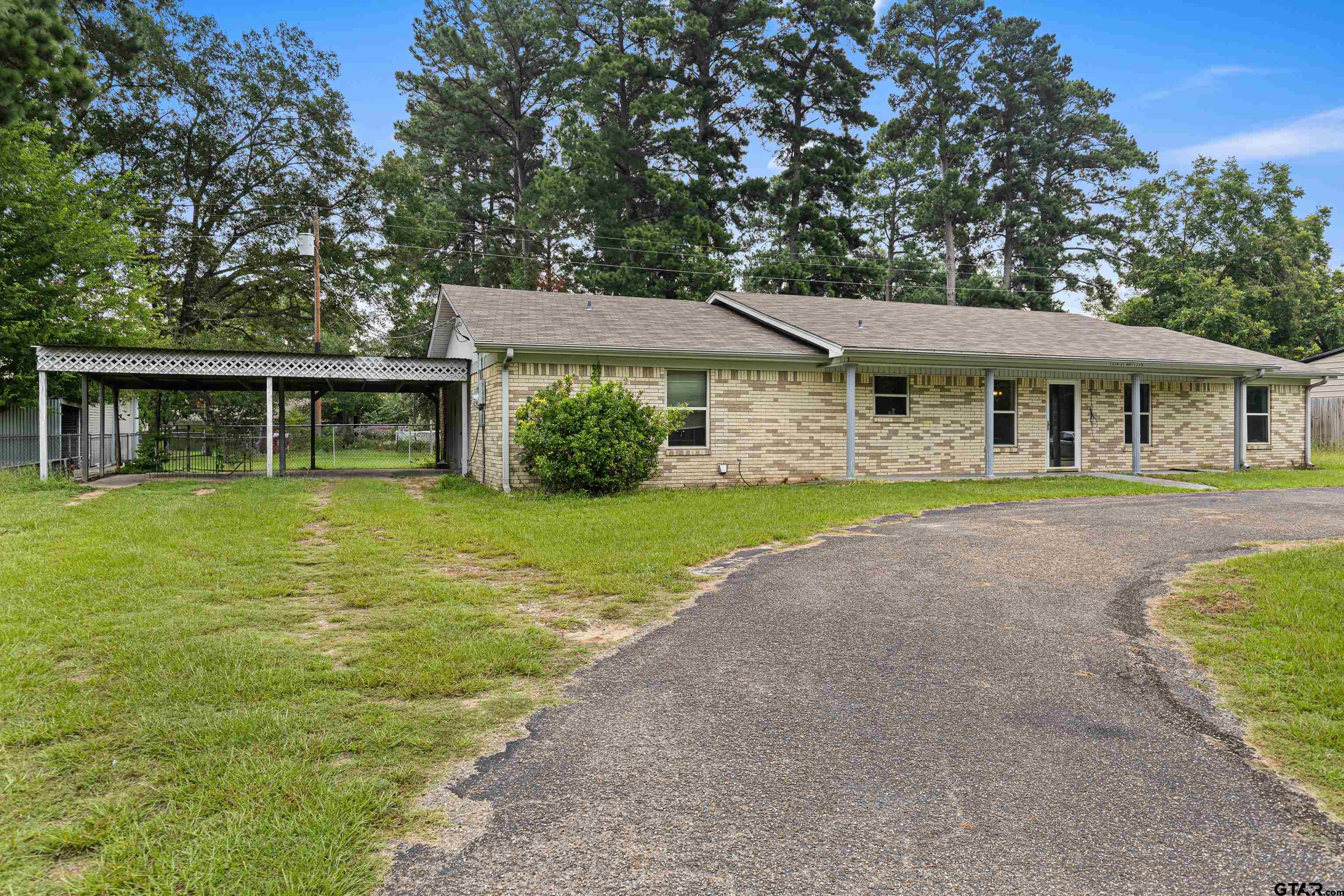 a house with trees in the background