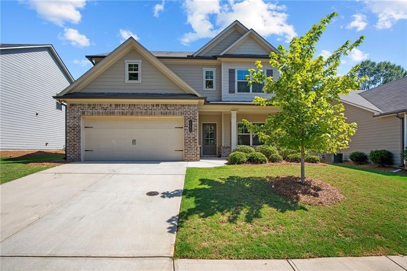 front view of a house with a yard