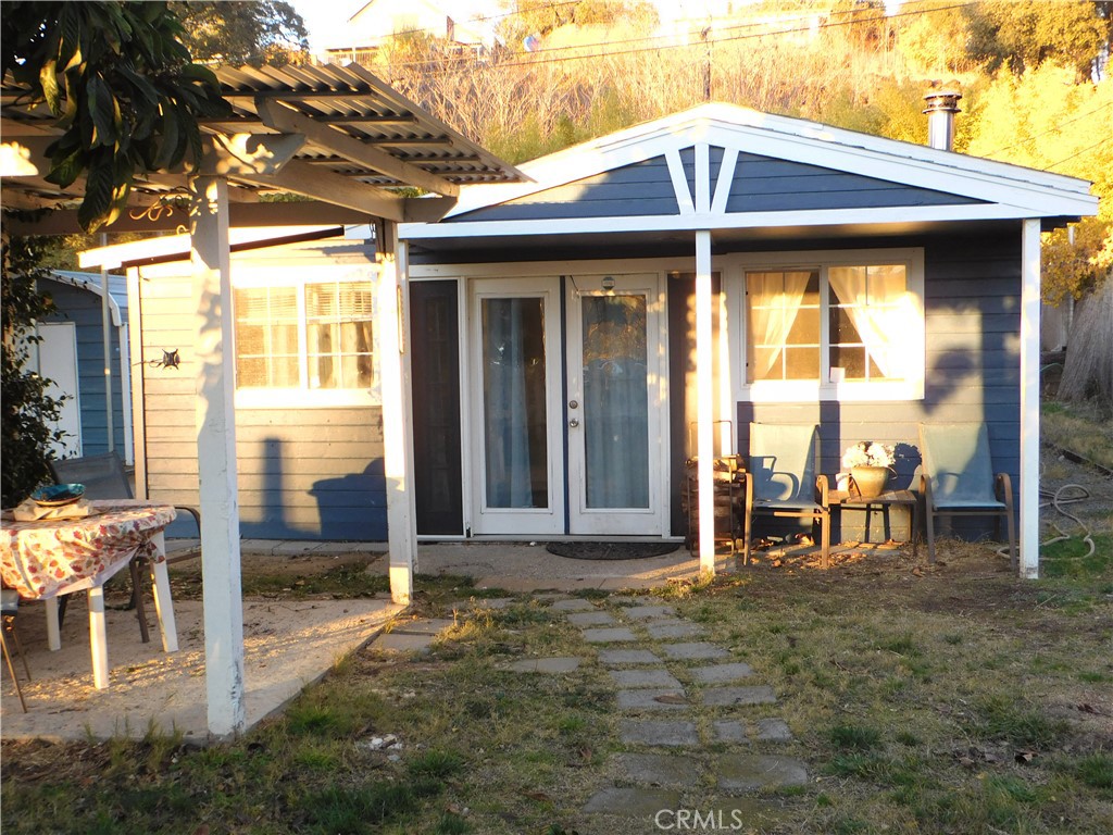 a view of a chair and table in front of house