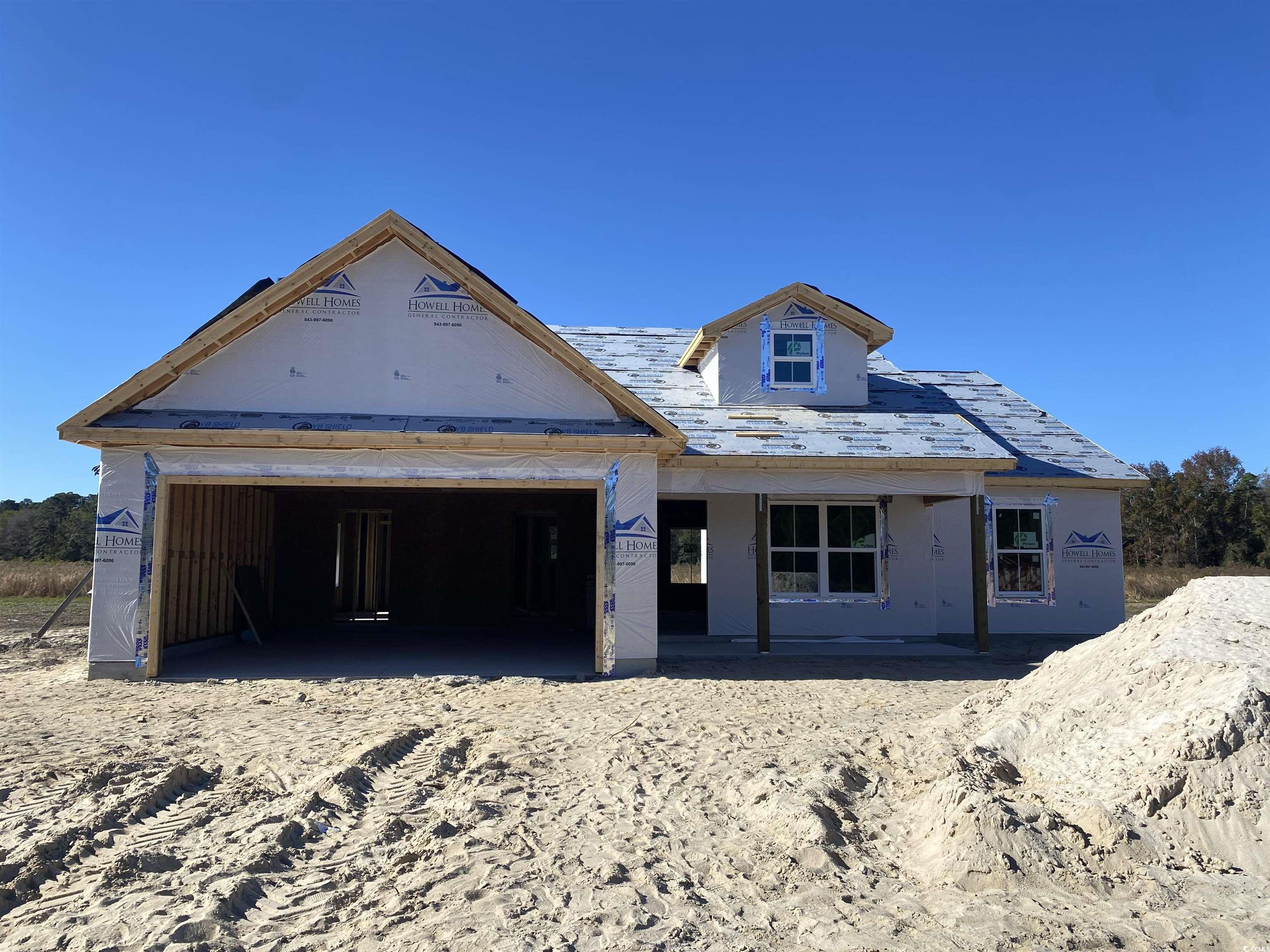 Unfinished property featuring a porch