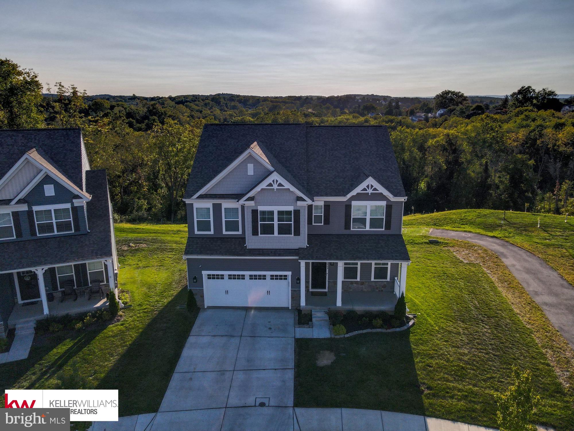 a aerial view of a house with a yard