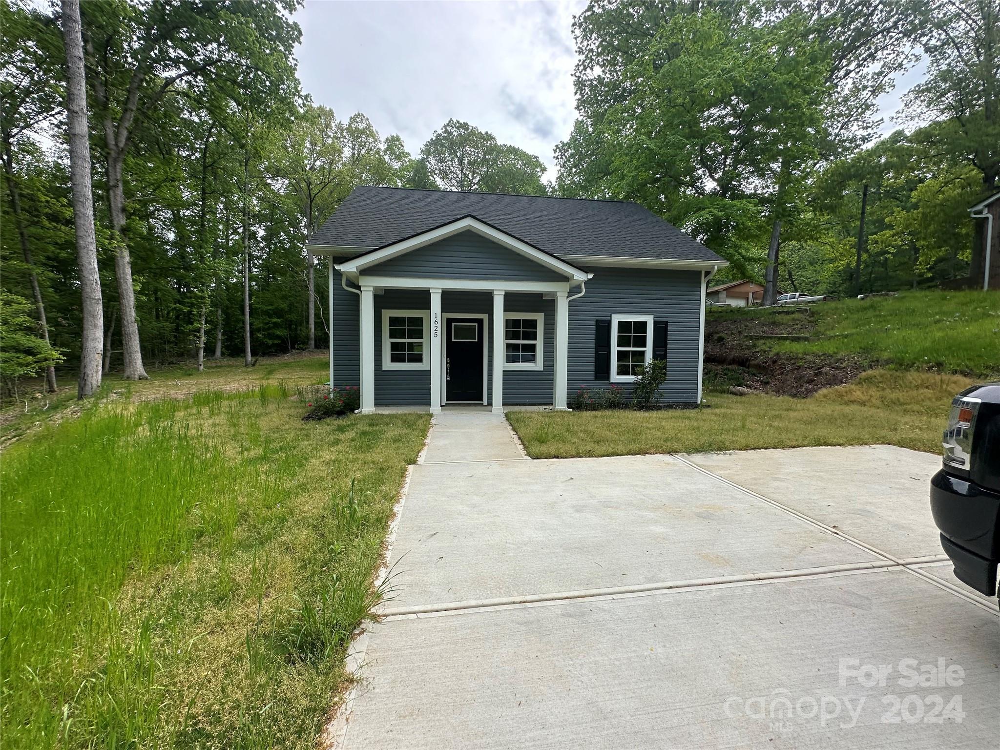 a front view of a house with yard