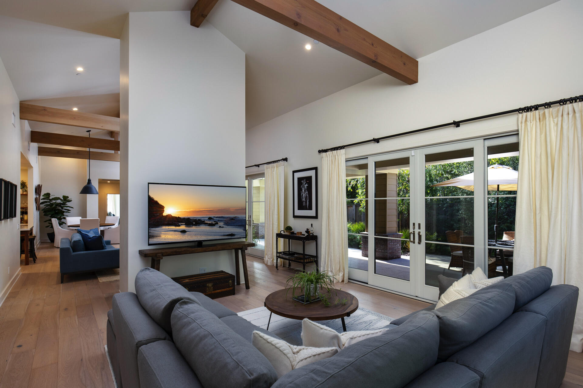 a living room with fireplace furniture and a flat screen tv