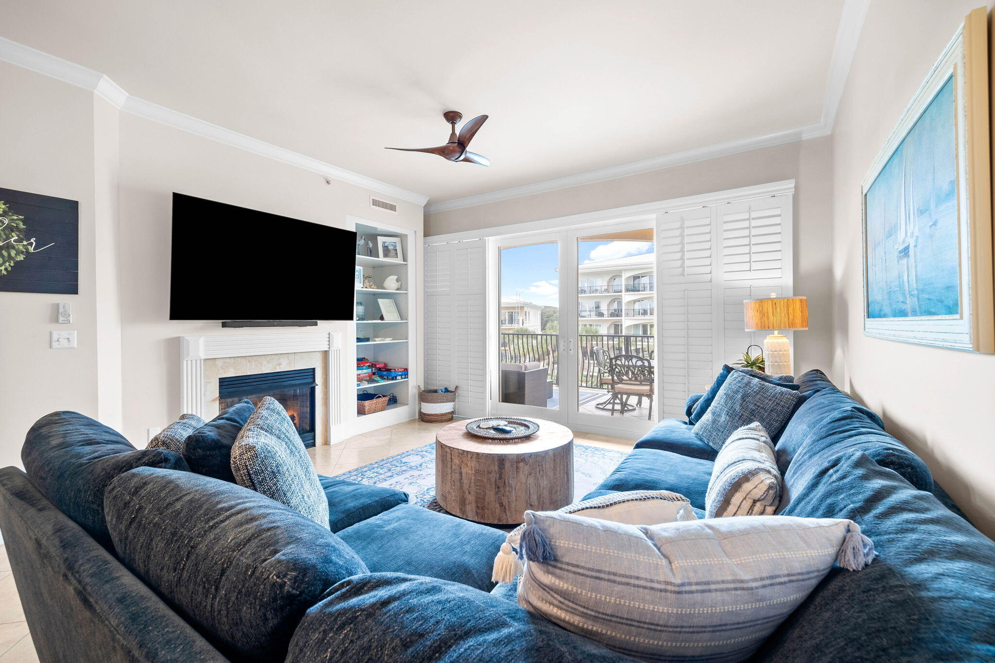 a living room with fireplace furniture and a flat screen tv