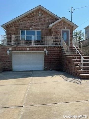 a front view of a house with garage