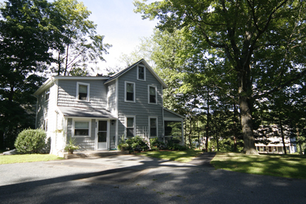 a front view of a house with a yard