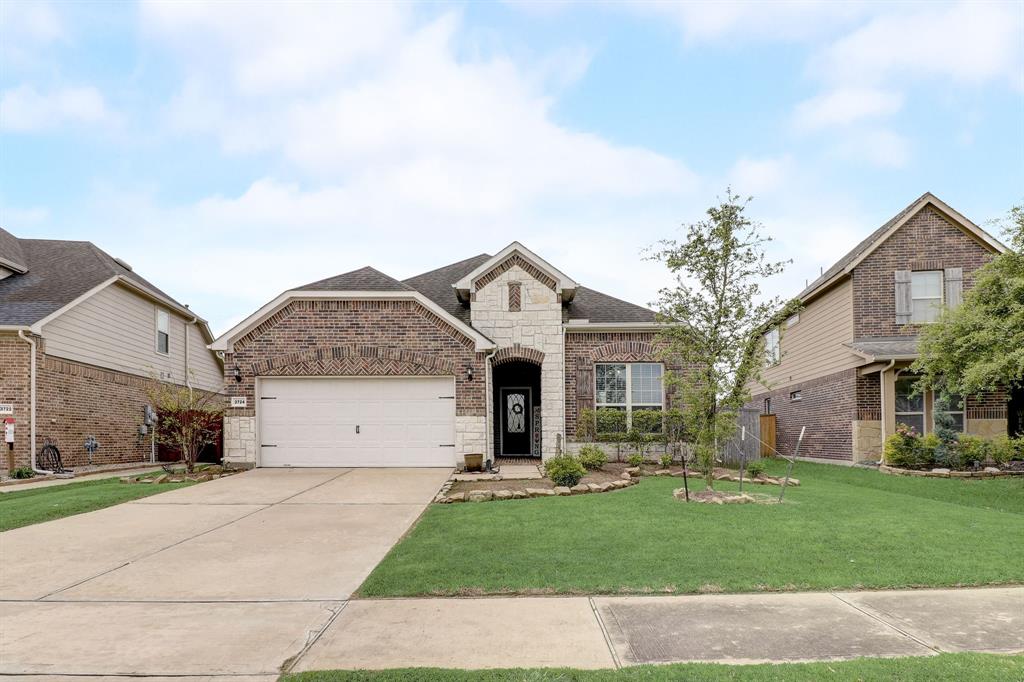 This home has ample yard space in front and the back, lush landscaping and well-maintained yard!