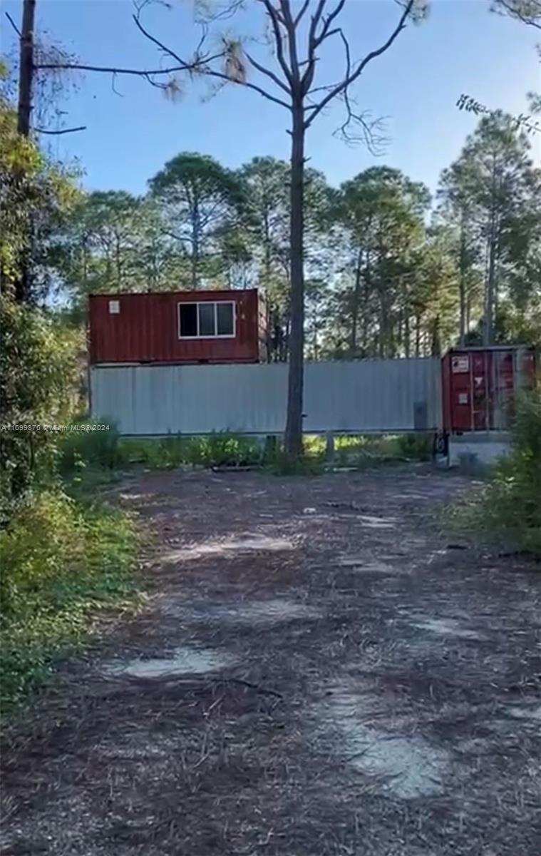 a view of a back yard of the house