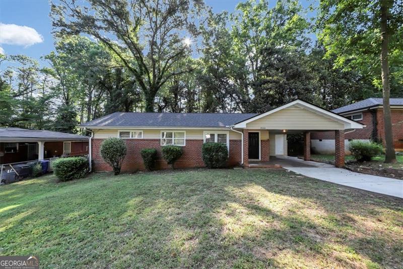 a front view of a house with yard