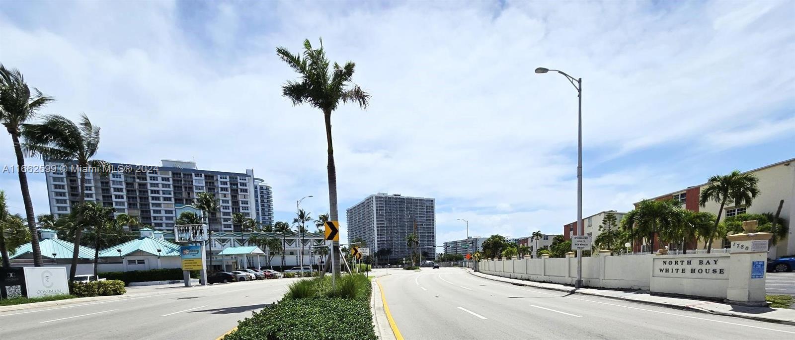 a view of a street with a building in the background