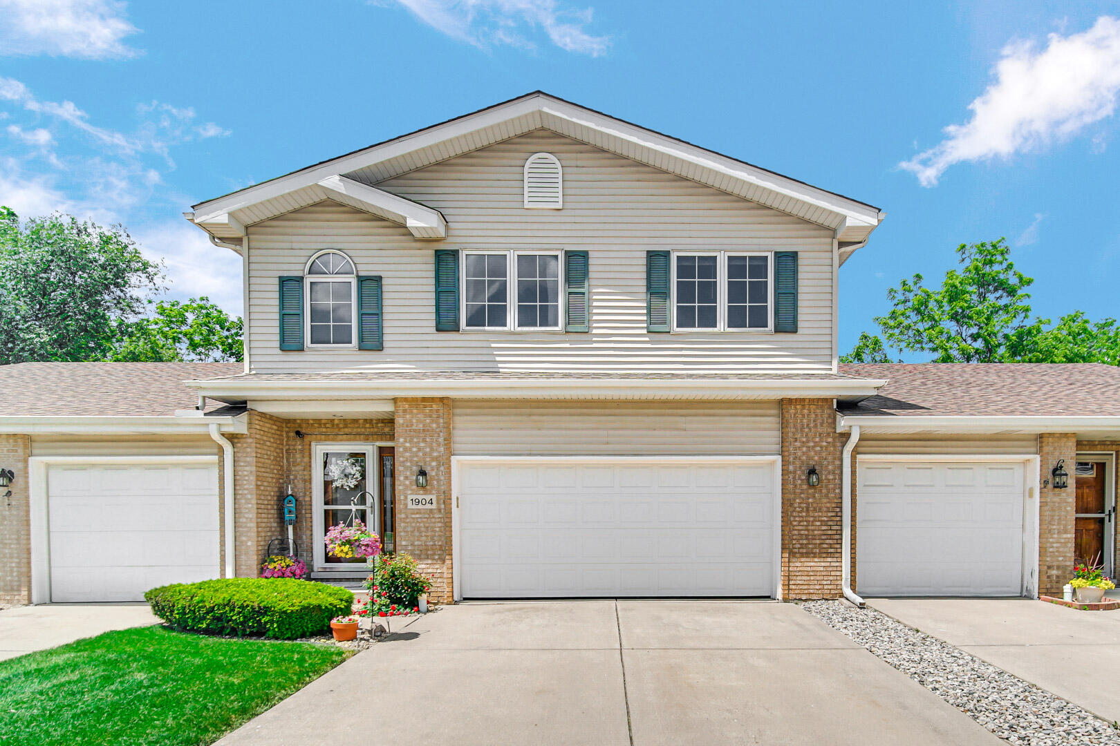 a front view of a house with garage