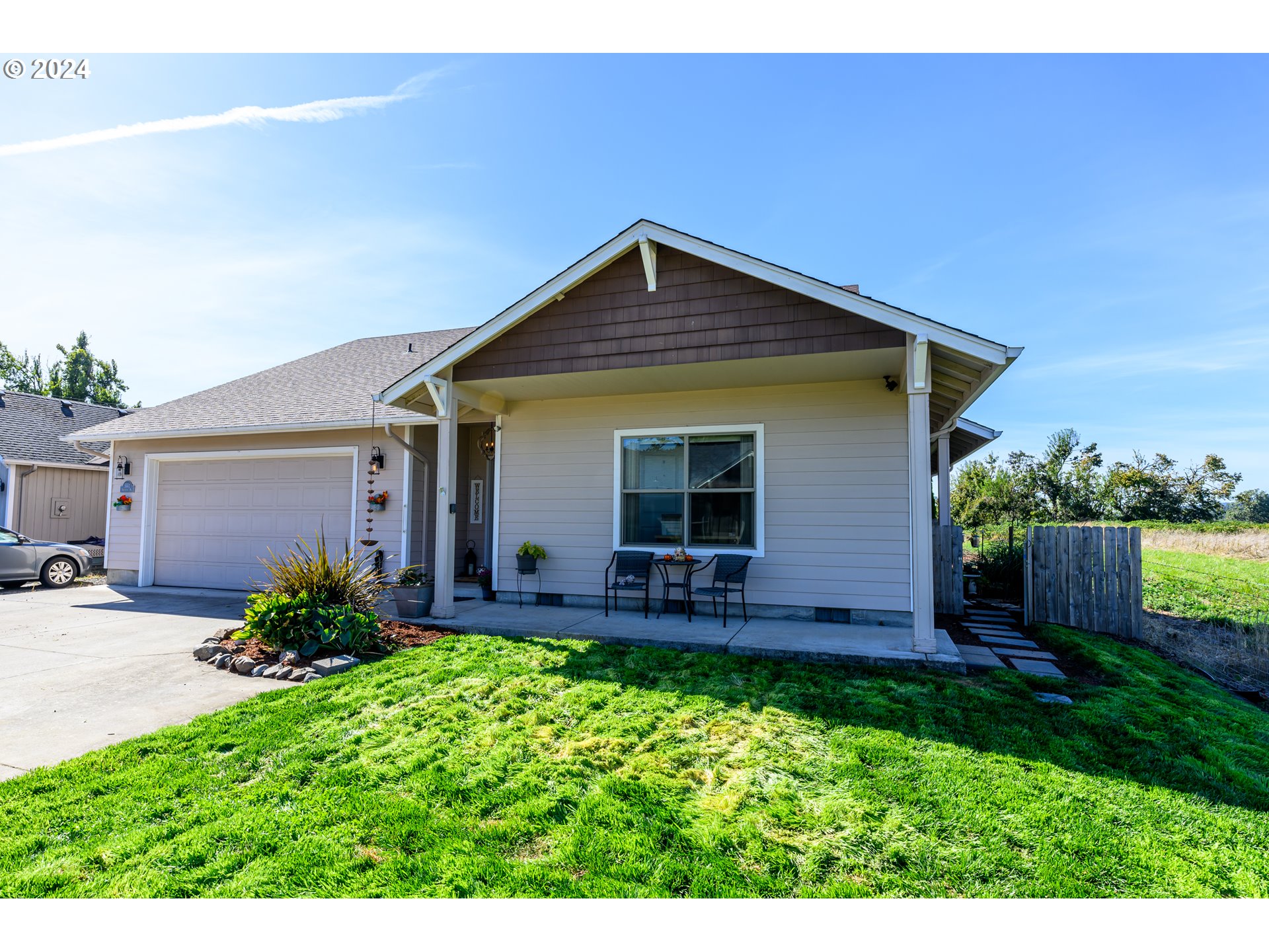 a view of front of house with a yard