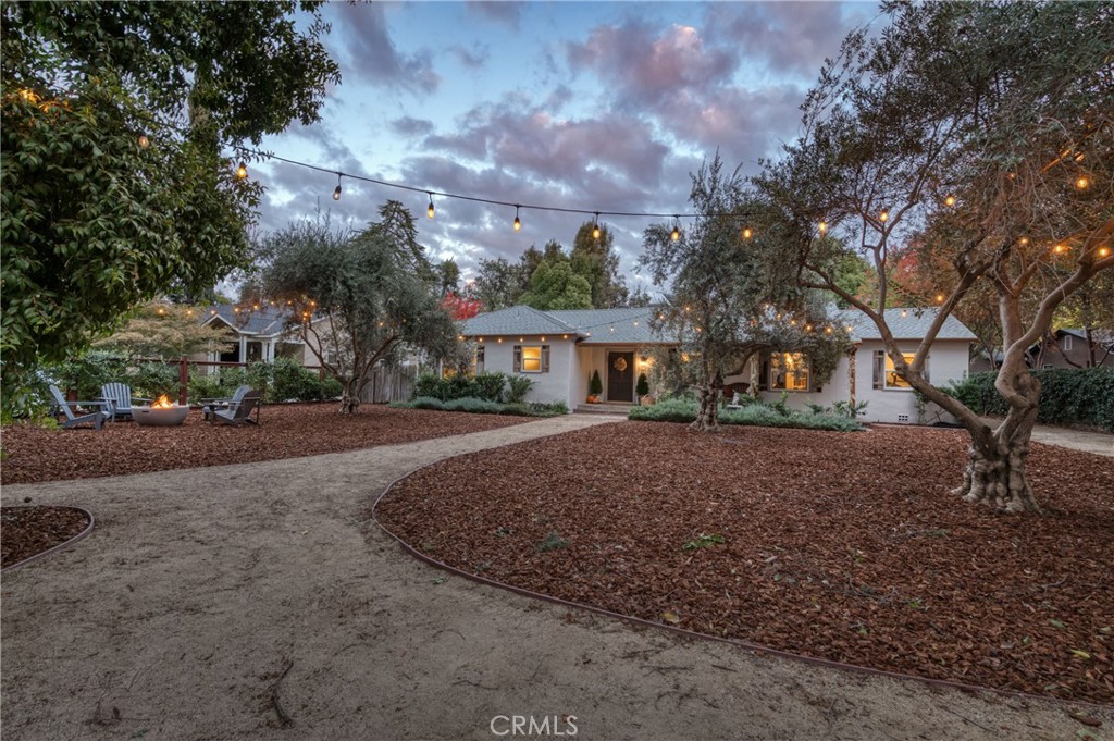 a view of house with outdoor space and tree s