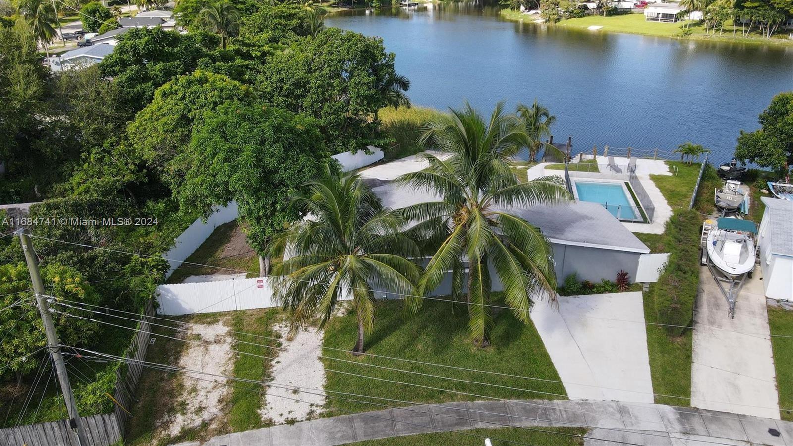 an aerial view of houses with yard