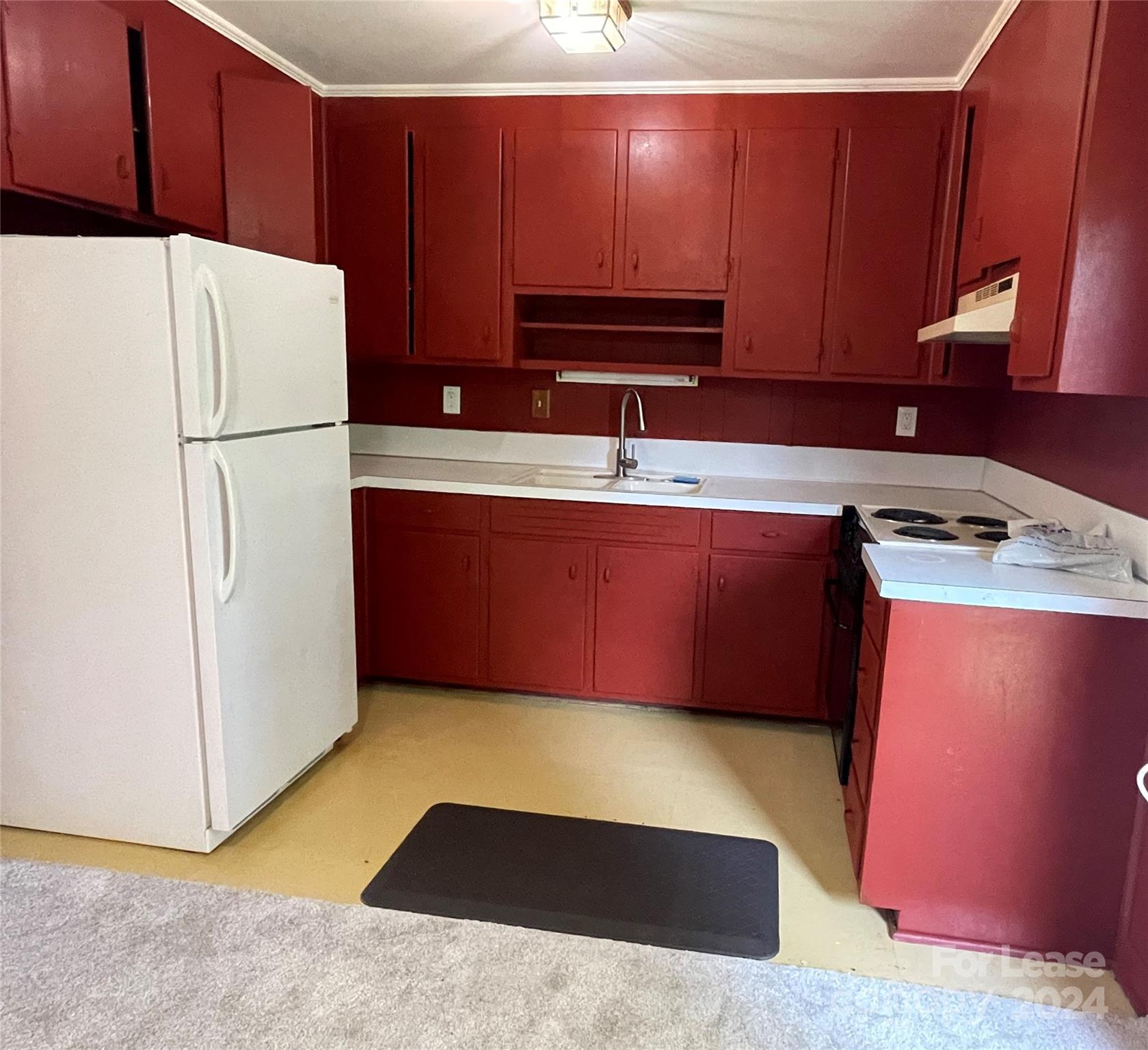 a kitchen with stainless steel appliances granite countertop a refrigerator sink and cabinets