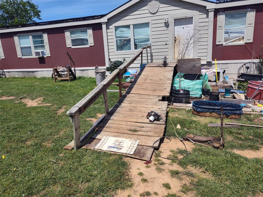 a view of house with yard