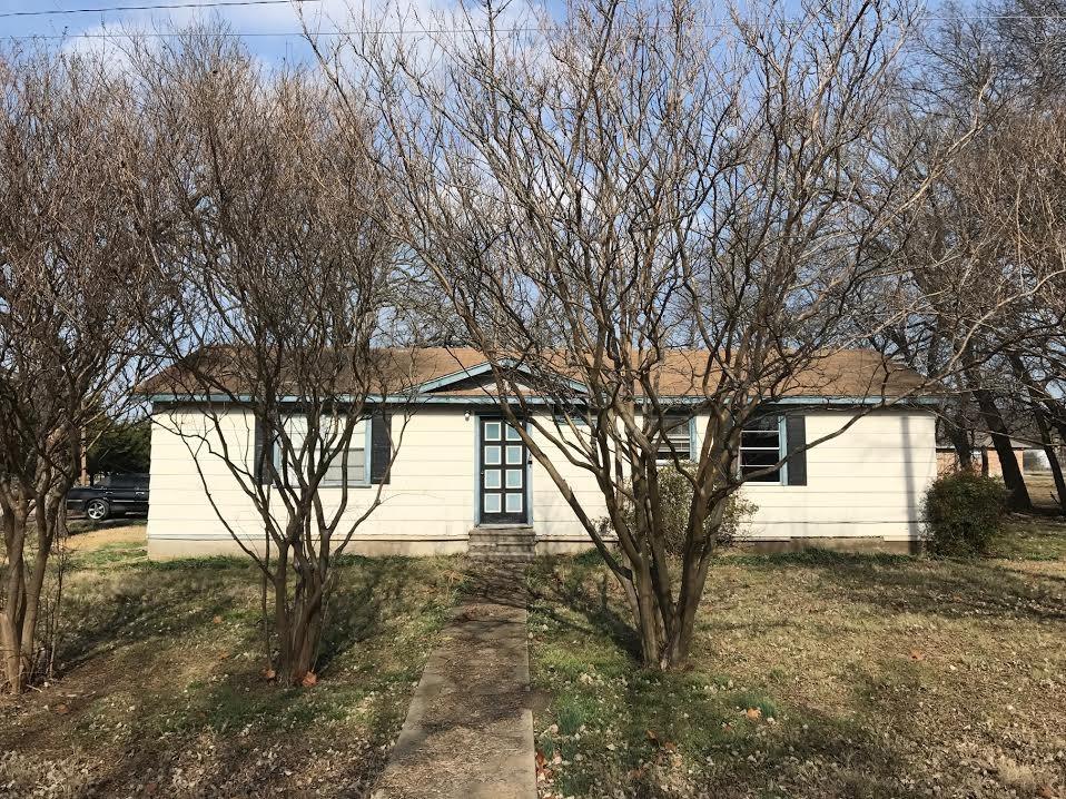 a view of tree in front of a house