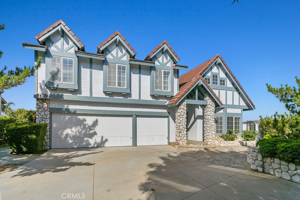 a front view of a house with a garage and a garage